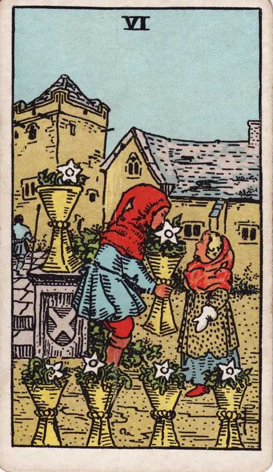 The Six of Cups from the 1909 deck: in an old garden a tall child bends to hand a smaller one a cup of small white flowers.